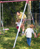 Swinging in the back yard  (click to enlarge)